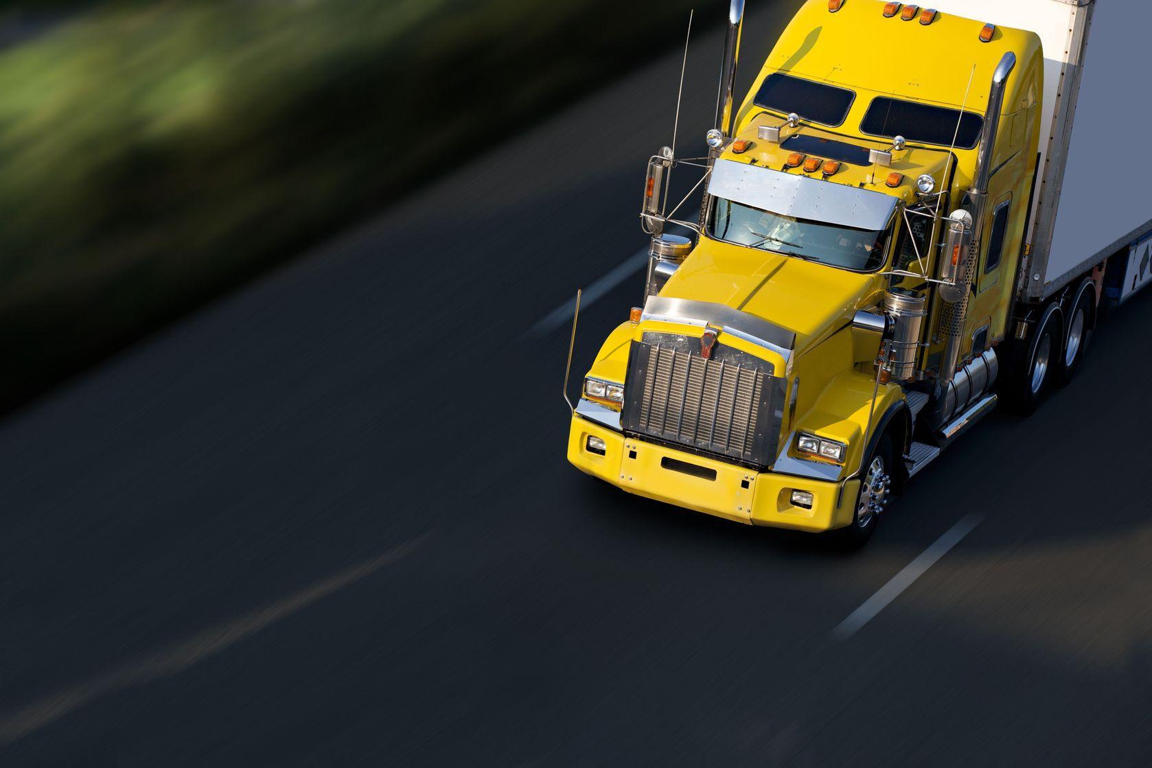 5673573 - speed yellow semi-truck on highway